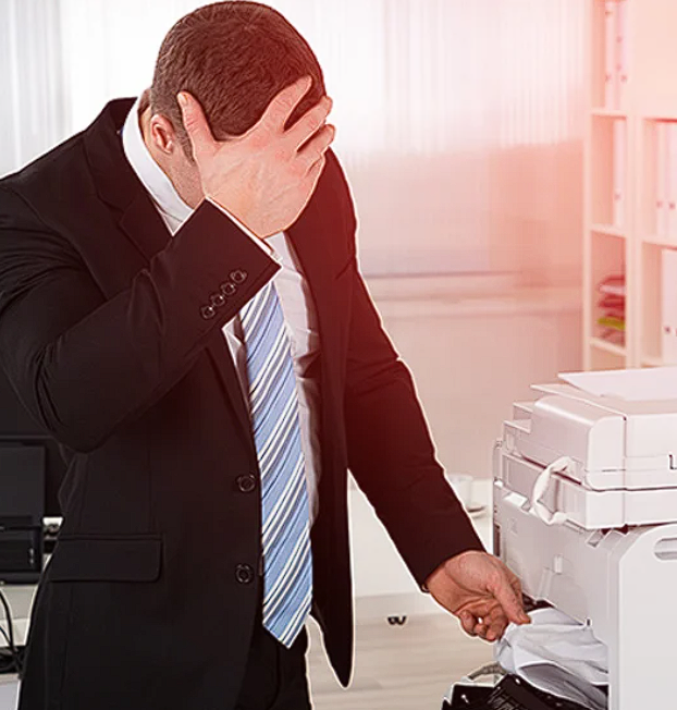 Office worker frustrated by an unreliable printer